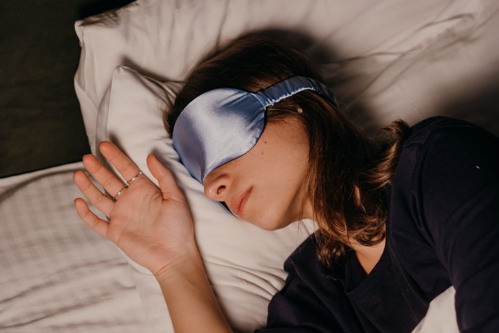 Blue fabric sleep mask shown during rest